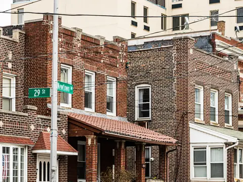 Attached brick houses at Newtown Avenue and 29th Street in Astoria, Queens