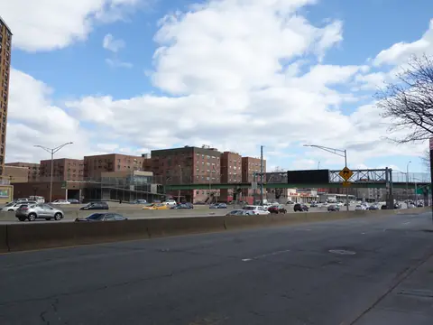 Apartment buildings beside a wide road in central Queens