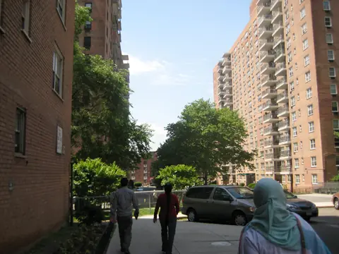 Apartment buildings and trees along Cherry Avenue in Flushing, Queens