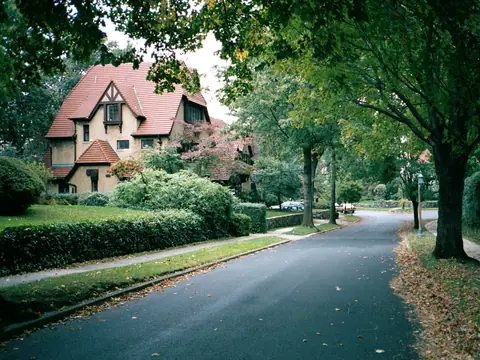 A Tudor-style house on a tree-lined street in Forest Hills Gardens, Queens