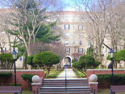 Garden apartment buildings around a landscaped courtyard in Queens